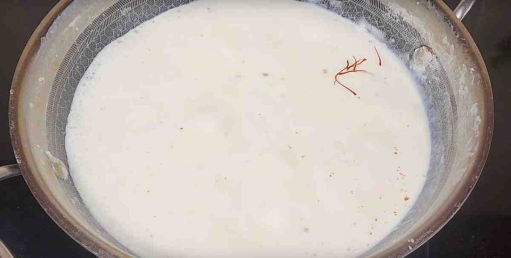 Making rabri from milk for Bread Kalakand Recipe