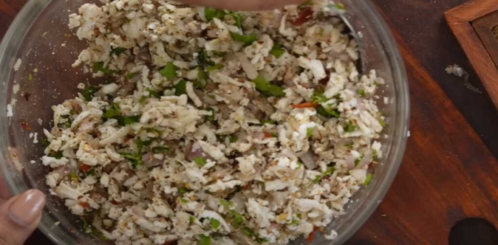 Preparing Paneer Paratha Masala